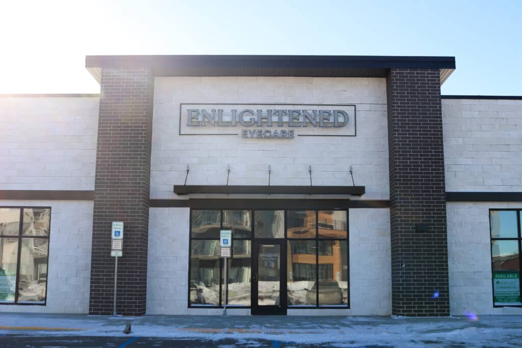 exterior of office building with sign saying Enlightened Eyecare